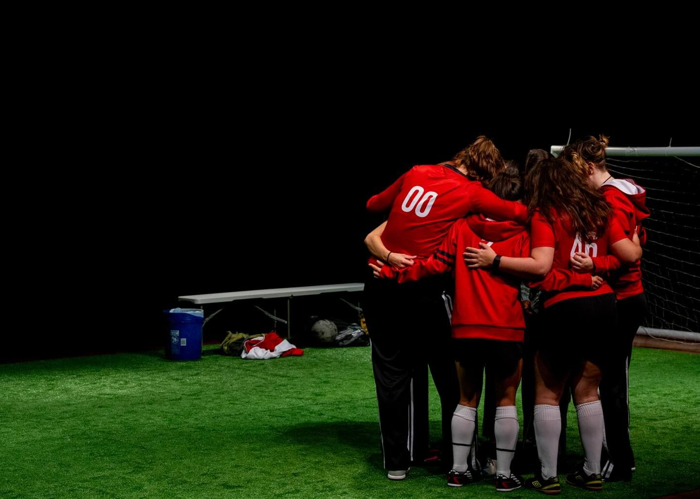 The team huddled together mid-scene