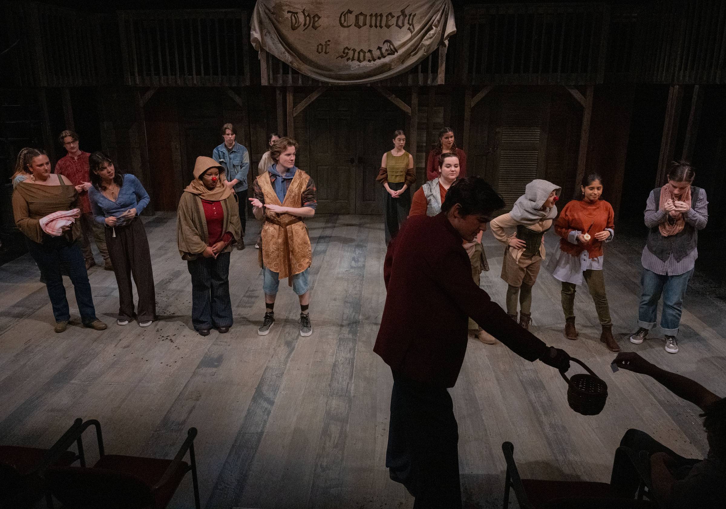 The company of The Comedy of Errors in a circle across the full set, seen from the house